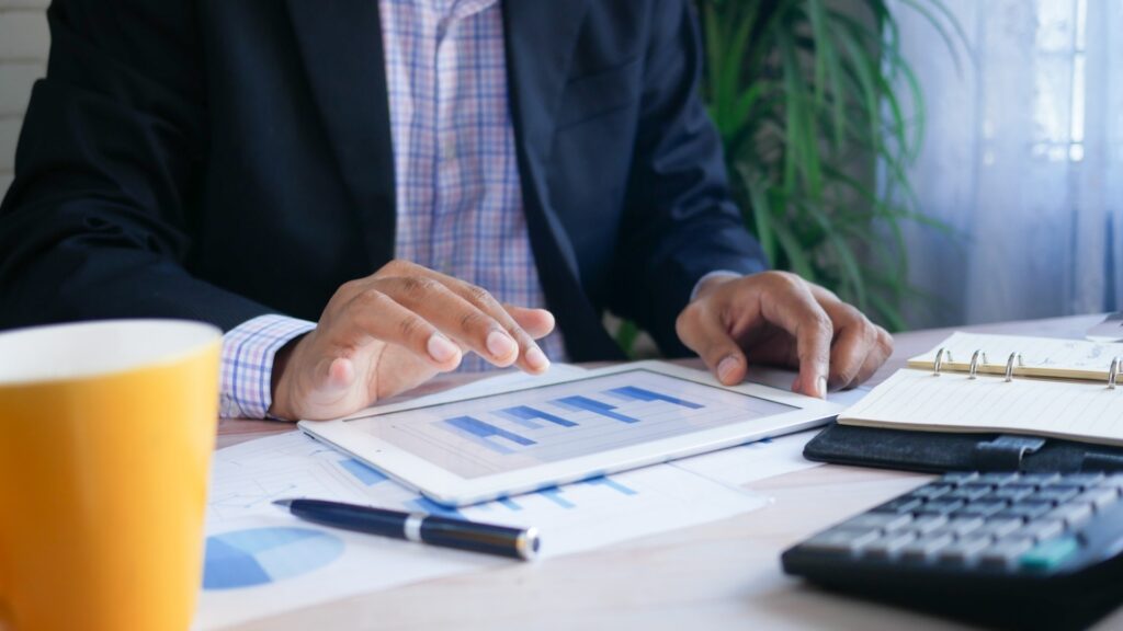 Man reviewing data on a tablet device