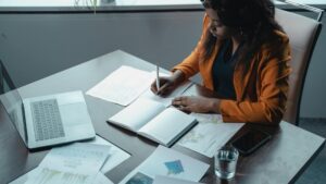 Woman reviewing financial data at a desk