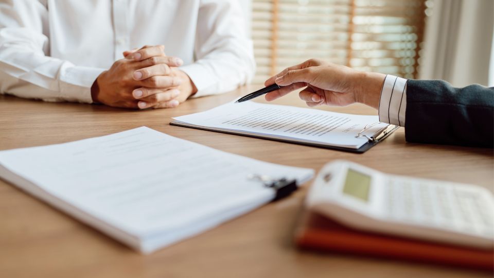 Two people discussing a document.
