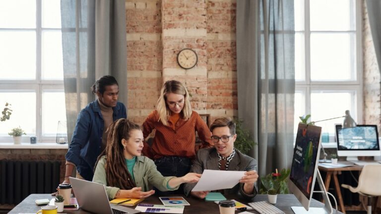 A group of people working together in an office.