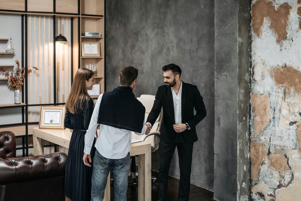 Three people meeting in an office.