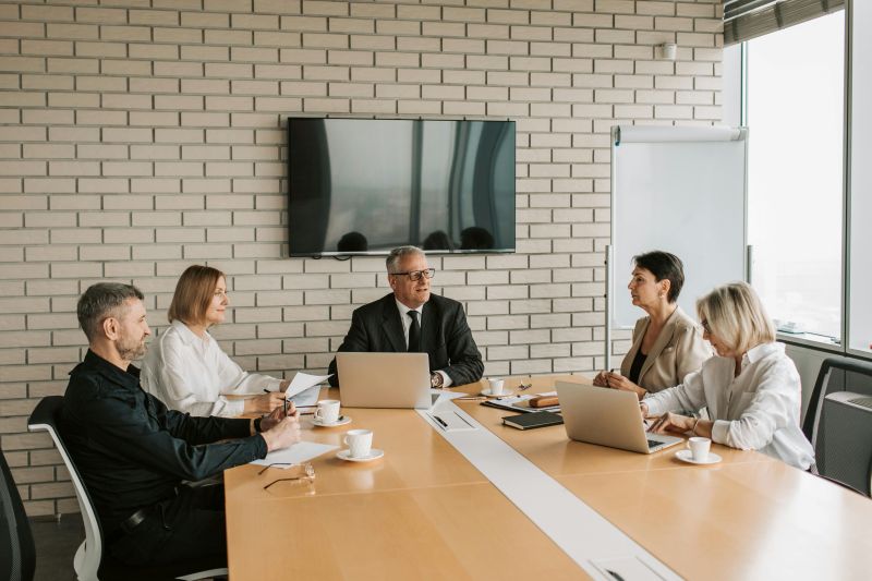 People sitting around a table in a conference room