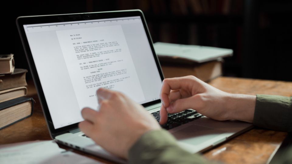 A lawyer is sitting at his desk, drafting a version of a legal document using ChatGPT.