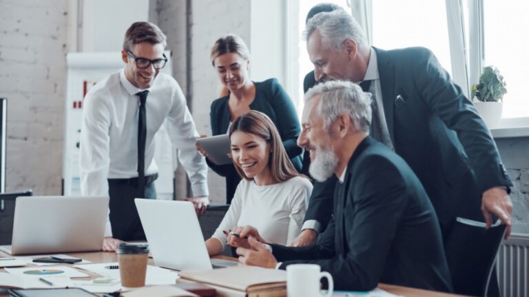 A group of professionals working in a conference room.
